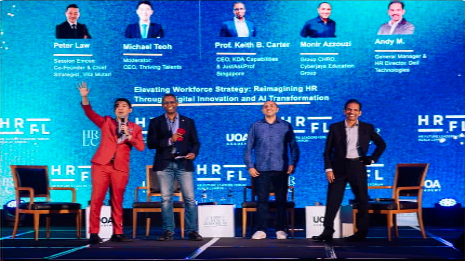Michael Teoh speaking on stage at an HR leadership panel